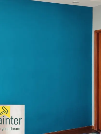 A vibrant teal accent wall in a bedroom. This deep, rich color adds personality and style.