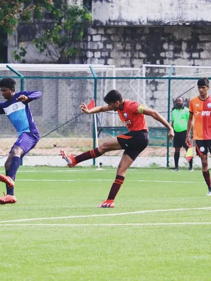 An intense moment as one of our players unleashes a powerful kick. I encourage my team to play with confidence and intensity.