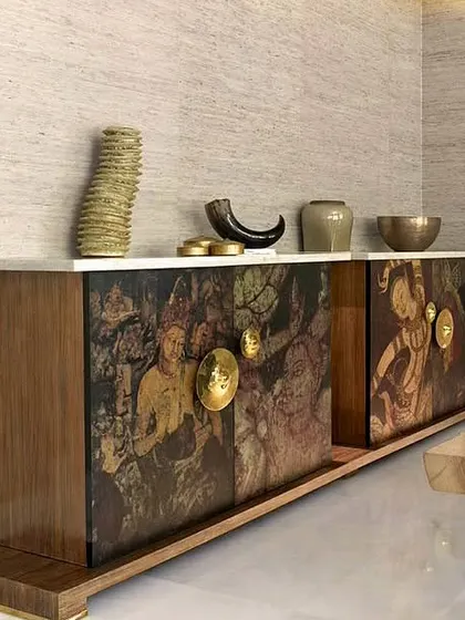 My art extends beyond walls. This custom credenza, created in collaboration with furniture designers, features artwork inspired by the ancient paintings of the Ajanta and Ellora Caves, turning a functional piece into a historic statement.