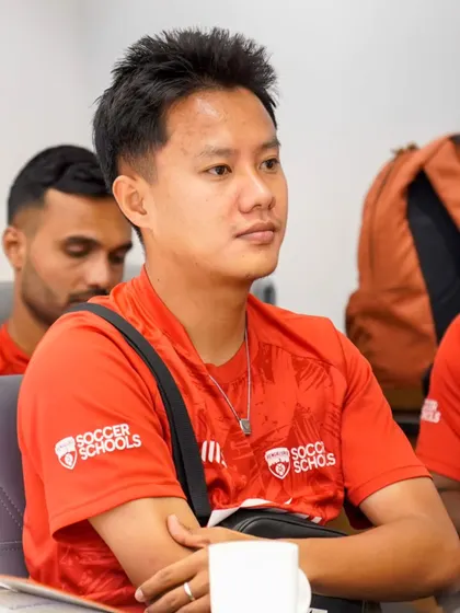 Our coaches are dedicated learners, seen here absorbing insights during a development session. This commitment to continuous improvement translates to better training for our players.