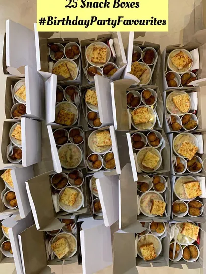 Another view of the 25 snack boxes ready for a birthday celebration.