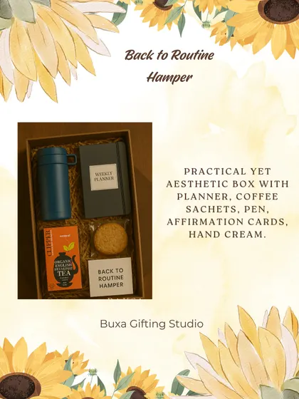 A "Back to Routine" hamper idea, perfect for August. It includes a weekly planner, coffee sachets, affirmation cards, and a travel mug.