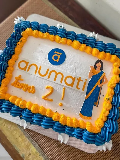 A vintage-style sheet cake for the 2nd anniversary of Anumati. I used their brand colors for the buttercream piping and included their logo and mascot for a personalized corporate celebration cake.