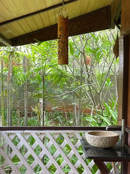 The open-air design of our cottages, like this outdoor sink area, allows you to stay connected with nature even in the simplest moments.