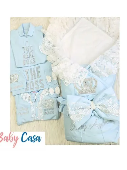 A complete family twinning set in light blue. This collection includes a newborn wrap and romper, along with matching "The Real Boss" and "The Boss" shirts for dad and big brother.