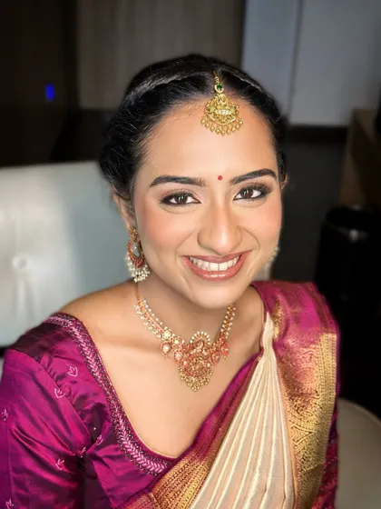 A bright, joyful smile is the best accessory. I ensured her makeup was luminous and fresh, with a natural pink lip that complements her happy glow.