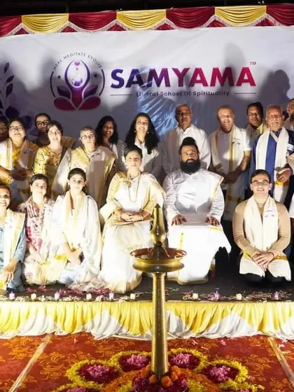A formal group photo from our Kerala retreat, with everyone seated before the sacred lamp. This picture captures the sense of community and shared purpose we cultivate.