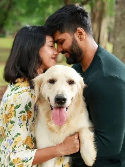 A maternity shoot filled with so much love, fun, and of course, treats. This intimate outdoor portrait captures the tender connection between the couple and their gorgeous Golden Retriever.
