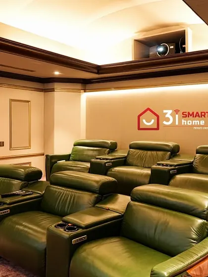 The combination of warm lighting, rich wood tones, and luxurious green leather creates a theater room that feels both grand and incredibly inviting.
