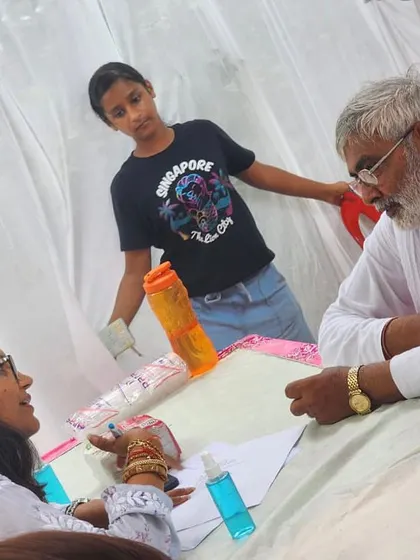 For me, nutrition is about community. Here I am at a medical camp, providing diet consultations. Making expert advice accessible to everyone is a core part of my mission and a way of continuing my father's vision of service.