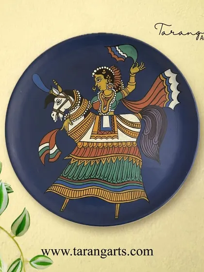 A wooden wall plate depicting a royal figure on a horse, painted in a vibrant folk art style. These plates are a wonderful way to add narrative and cultural richness to your home decor.
