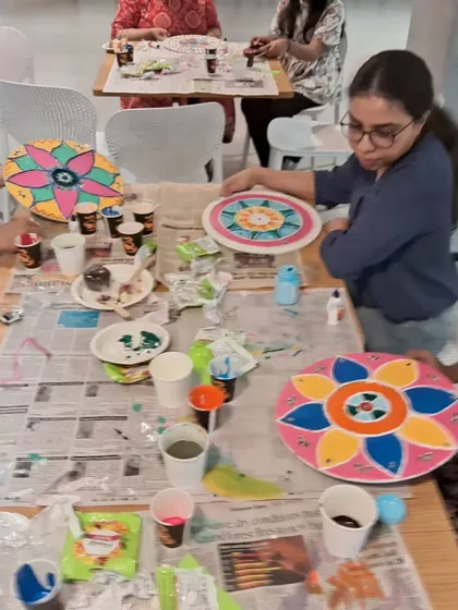 A snapshot of the creative energy during a Lippan workshop. With paints, mirrors, and clay at their disposal, team members get to experiment with different colors and textures.