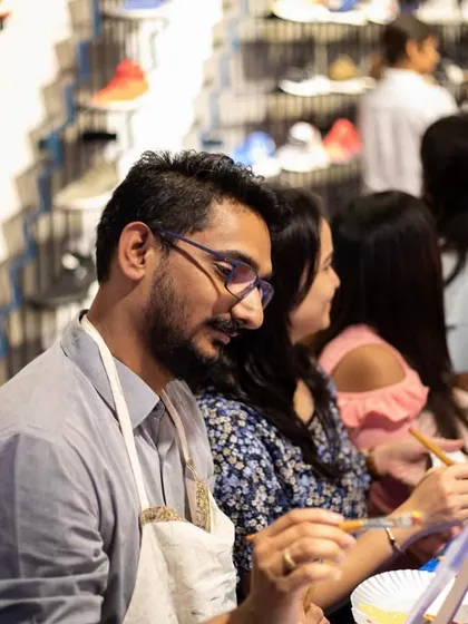 A participant at the Adidas event, completely focused on his artwork. We love creating unique experiences that align with a brand's identity.