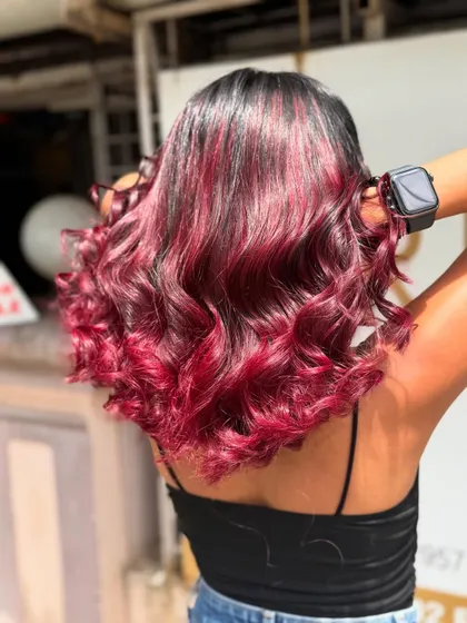 This Redwine Balayage is all about depth and vibrancy. It's a bold choice that is incredibly chic and modern.
