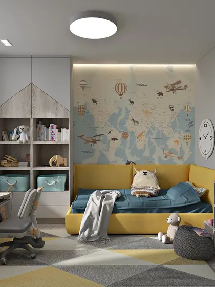 This angle shows the integrated study desk and bookshelf unit, designed to be both functional and in keeping with the room's playful theme.