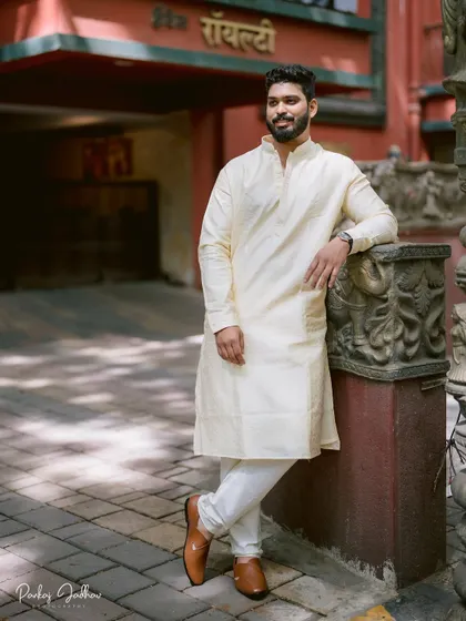 A handsome portrait of the groom, Aditya, looking relaxed and happy before his engagement ceremony.