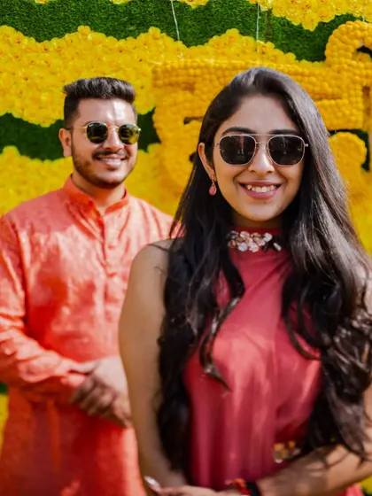A cool and casual portrait of Garv and Sonali at their Haldi. Their sunglasses and confident smiles perfectly capture the fun and relaxed atmosphere of the event.