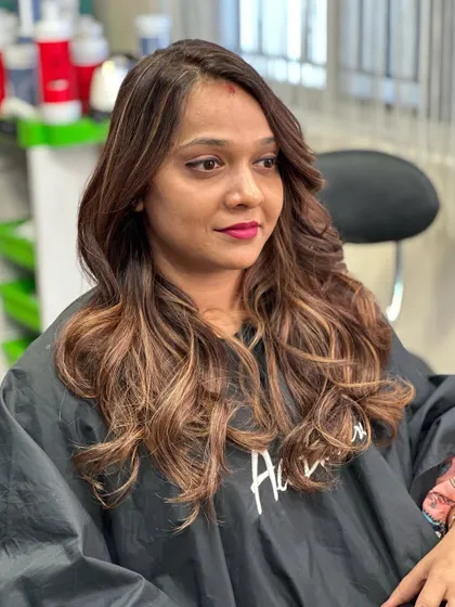 A close-up of the client enjoying her new hair.