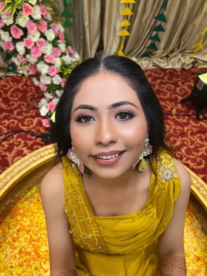 A top-down shot of the bride during the ceremony, her makeup looking fresh and radiant.