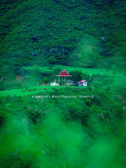 A view of the Kawanti Bhutnaath temple through the mist, surrounded by lush green mountains. This photo showcases the mystical beauty of the Himachali landscape.