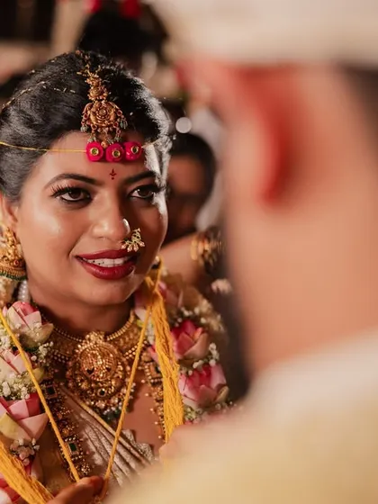 A close-up of the bride's beautiful expression as she looks at her groom during the wedding ceremony, a candid moment full of love.