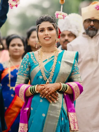 The bride's procession, looking confident and radiant as she walks towards the mandap.