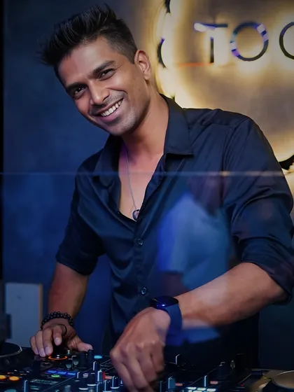 A classic shot of me at the console at Toca, with a smile that shows I'm exactly where I belong.