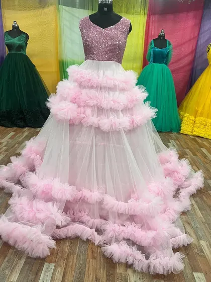 This pink and white tiered ruffle gown with a sequin top is a true showstopper.