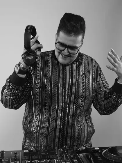 A black and white version of a candid moment, showing the joy I find in my work. A happy DJ means a happy dance floor.