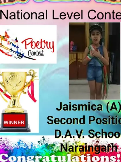 Announcing the second-position winner of the poetry contest. Her confident pose shows she is ready to perform.