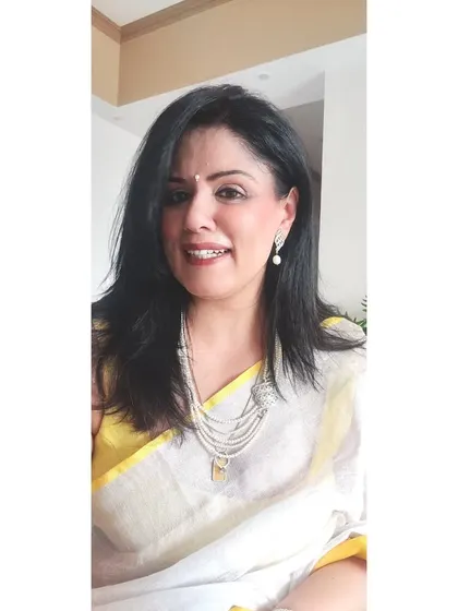 My mother's pearls are one of my most treasured possessions. Here, I've layered a multi-strand pearl necklace over a linen saree for a look that is both classic and deeply personal.