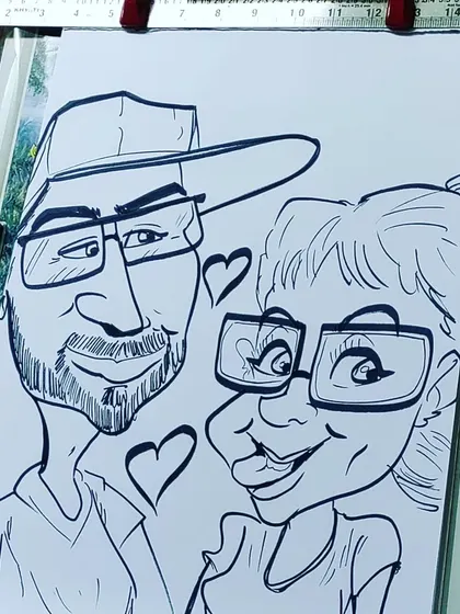 Hearts and smiles all around in this lovely couple's caricature. It’s a great example of a romantic and funny gift.