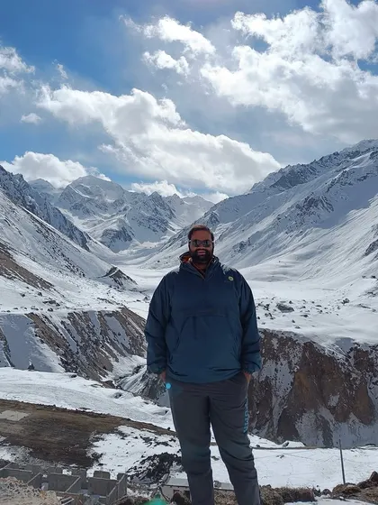 **People of Compartment S4: Monik Shah:** Monik in the Himalayas, a landscape that informs his context-sensitive design process. For him, architecture is about shaping experiences.