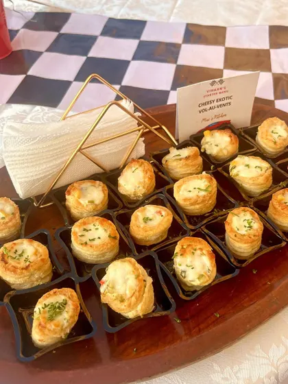 Cheesy Exotic Vol-au-vents on a serving tray, perfect for a high-tea or cocktail event.