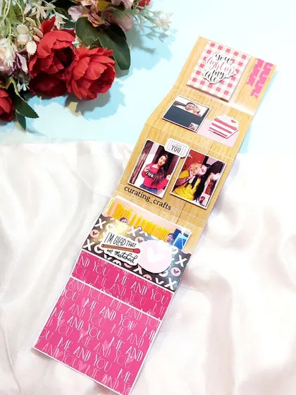 The reverse side of the photo strip, showing more pictures and decorative patterns.