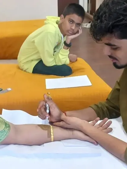 It's a special moment to apply mehandi for the mother of the bride. I create elegant designs that are perfect for her.