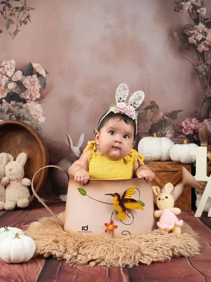 This little bunny is celebrating her half-birthday. Sitter sessions are perfect for capturing those curious expressions.