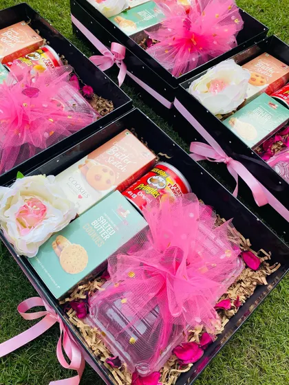 I can prepare large orders of custom Diwali hampers for pan-India shipping. Here, multiple boxes are ready to be sent out, each consistently packed with goodies and festive cheer.