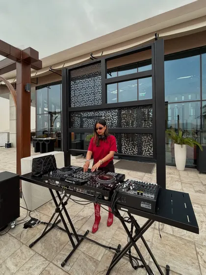 A wider angle of my DJ setup on the terrace, showing how I integrate into the event space.