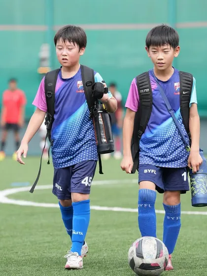 Friends on and off the field. Two of our young players walking together after a training session.