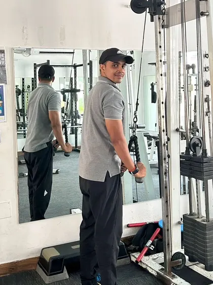 At the gym in Noida Sector 99, ready for a cable workout.