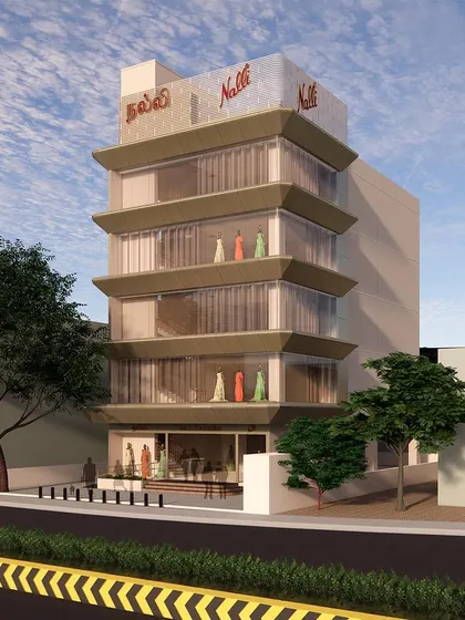 An early render of the Nalli facade, exploring the concept and its Art Deco inspirations. The design aims to maximize the visual merchandising area on a prominent corner property.