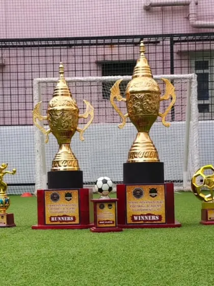 The trophies for the winners and runners-up are on display before the final match. This builds anticipation and gives players a glimpse of the prize they are competing for.