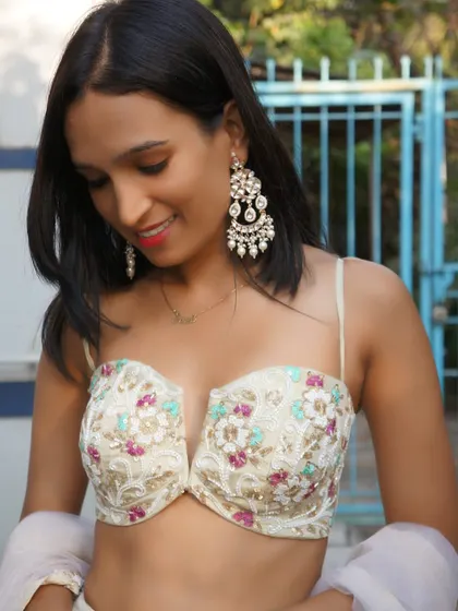 New stock in. A close-up of the beautiful bustier top from our ivory floral lehenga, showing the delicate craftsmanship.