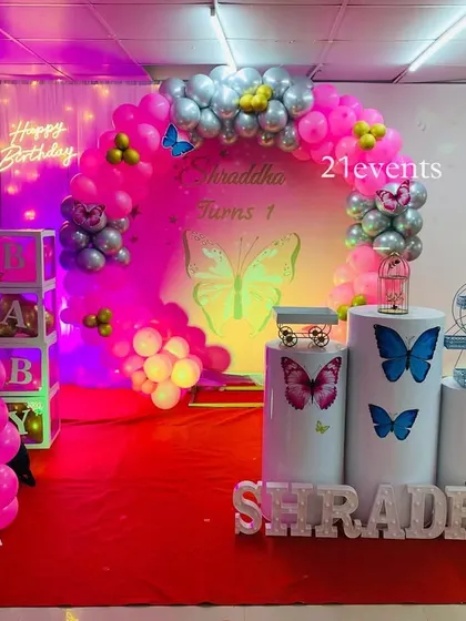 Another view of the butterfly theme, showing the full setup with marquee letters and 'BABY' blocks.