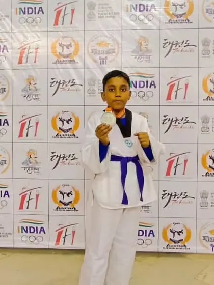 Rohan showing his silver medal from the Maharana Pratap National Taekwondo Championship 2023.