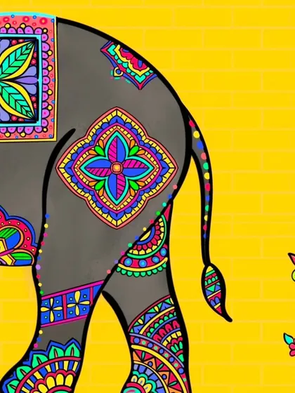 A view of the elephant's hindquarters, showcasing the beautiful mandala-like patterns and decorated tail.