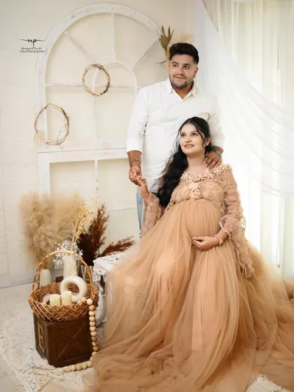 Half of me and half of you. This beautiful couple's portrait in our boho setup perfectly captures the feeling of two people becoming a family.