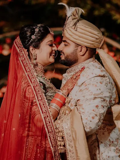 A happy, candid moment between the newly married couple. Their smiles and the way they look at each other tell a story of love and joy, which is exactly what we aim to capture.