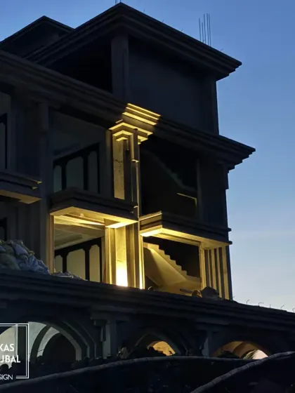 An evening shot of a resort under construction. Here, we were testing the exterior lighting design to see how it interacts with the architectural forms, ensuring a dramatic effect once completed.